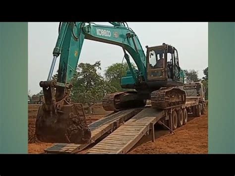 how to load and unload a mini excavator|how to unload an excavator.